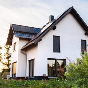istockphoto-1987087979-612×612 Exterior of a newly built single-family home in Germany. The house has solar panels on the roof and is built to modern standards in terms of sustainability.